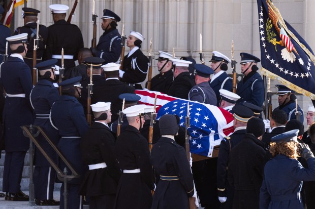 WASHINGTON, DC - JANUARY 09: U.S. Military Body Bearers carry the casket bearing the remains of former U.S. President Jimmy Carter into the Washington National Cathedral for his state funeral on January 9, 2025 in Washington, DC. President Joe Biden declared today a national day of mourning for Carter, the 39th President of the United States, who died at the age of 100 on December 29, 2024 at his home in Plains, Georgia. Following the state funeral, Carter's remains will be returned to Plains, Georgia where he will be interred after a private family service. (Photo by Saul Loeb-Pool/Getty Images)