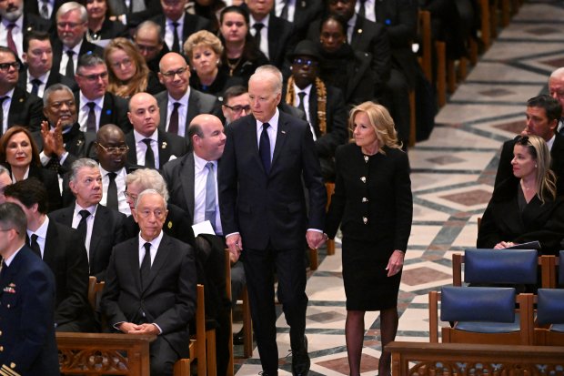 US President Joe Biden and First Lady Jill Biden arrive to attend the State Funeral Service for former US President Jimmy Carter at the Washington National Cathedral in Washington, DC, on January 9, 2025. (Photo by Mandel NGAN / AFP) (Photo by MANDEL NGAN/AFP via Getty Images)