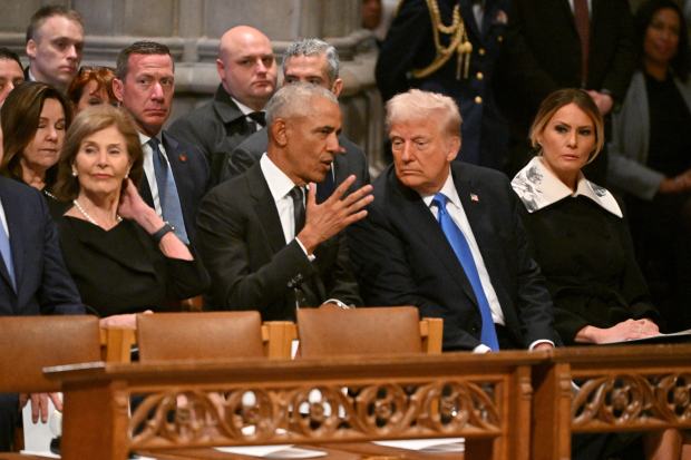 Former US President Barack Obama speaks with President-elect Donald Trump as they attend the State Funeral Service for former US President Jimmy Carter at the Washington National Cathedral in Washington, DC, on January 9, 2025. (Photo by ROBERTO SCHMIDT / AFP) (Photo by ROBERTO SCHMIDT/AFP via Getty Images)