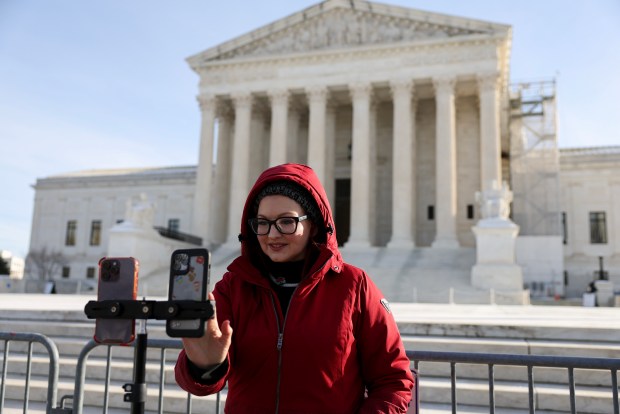 TikTok educational influencer, Tiffany Cianci livestreams outside the U.S. Supreme Court Building as the court hears oral arguments on whether to overturn or delay a law that could lead to a ban of TikTok in the U.S., on January 10, 2025 in Washington, DC.