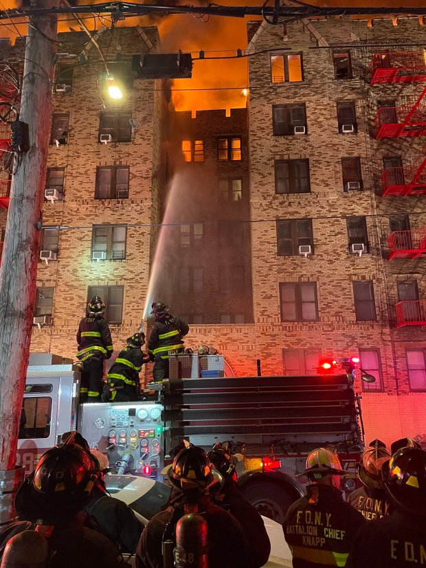 The fire broke out on the top floor of the Mayfair Apartments on Wallace Ave. near Arnow Ave. in the Allerton section of the Bronx at about 1:40 a.m. and quickly spread to the cockloft between the ceilings of the top floor apartments and the roof. (@FDNY via X.com)