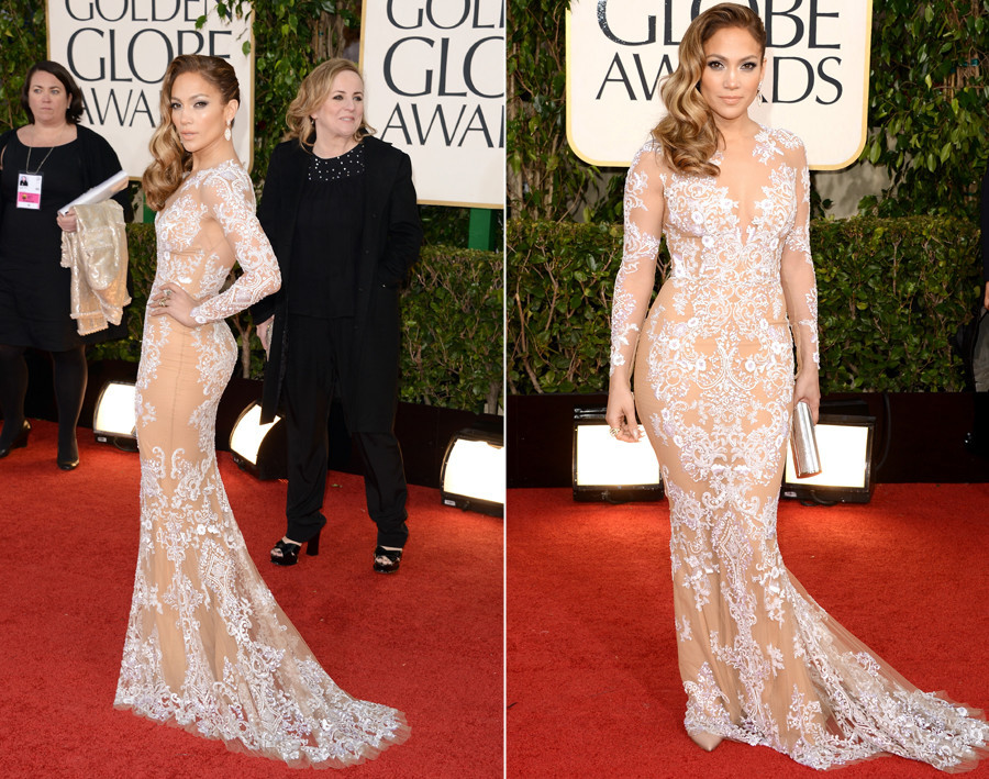 Another awards show, another excuse for Jennifer Lopez to show off her famous va-va-voom figure. The superstar went for nude in a sexy sheer illusion dress with a deep V neckline by designer Zuhair Murad.