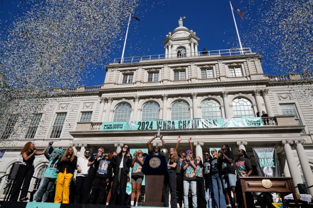 The New York Liberty, their supporters, local officials and others celebrate during a ceremony in honor of the Liberty's WNBA championship at City Hall in New York, Thursday, Oct. 24, 2024. (AP Photo/Seth Wenig)