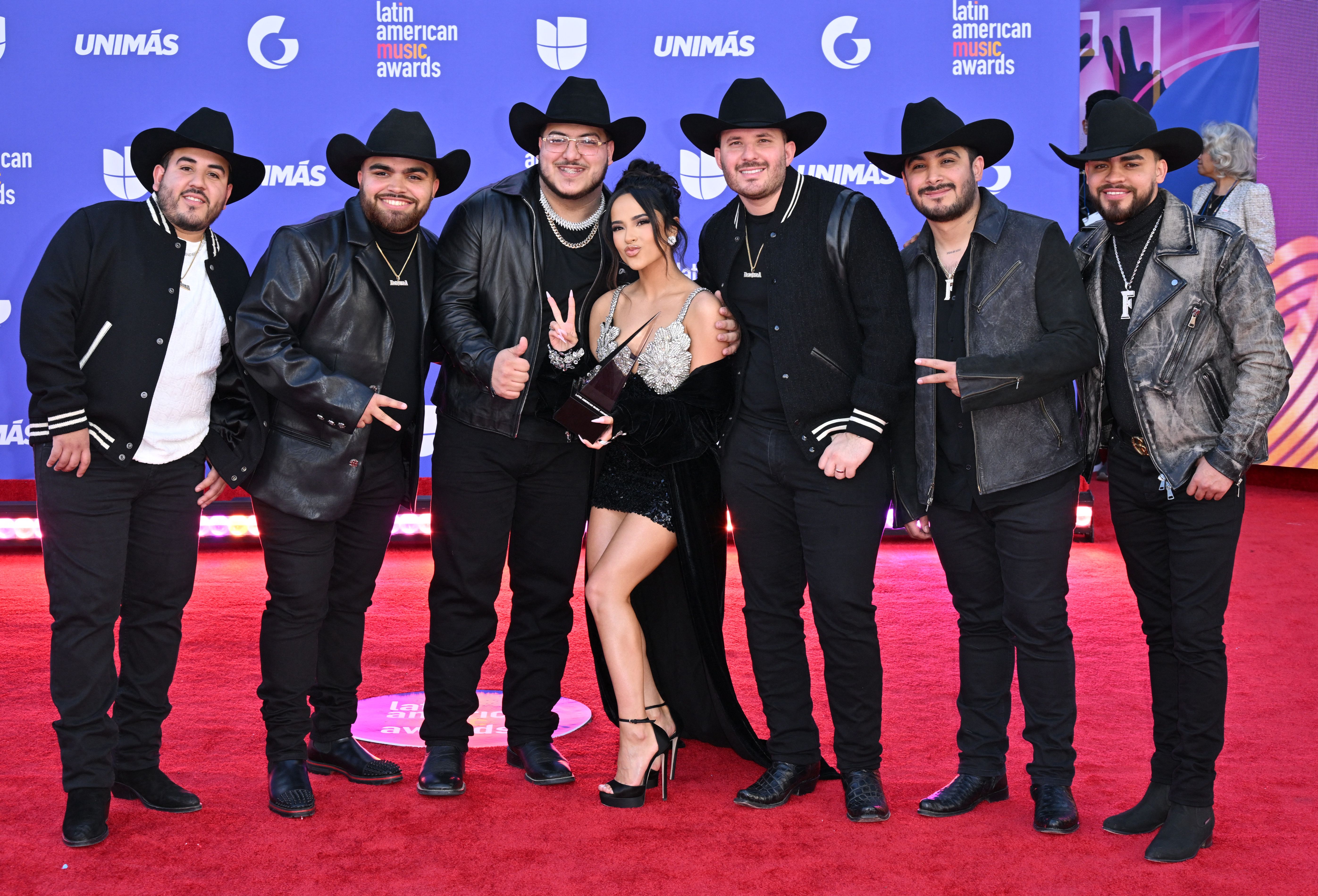 Becky G poses with Grupo Frontera on arrivals for the 8th annual Latin American Music Awards at the MGM Grand Garden Arena in Las Vegas, Nev., on April 20, 2023. Becky G poses with Grupo Frontera on arrivals for the 8th annual Latin American Music Awards at the MGM Grand Garden Arena in Las Vegas, Nev., on April 20, 2023.