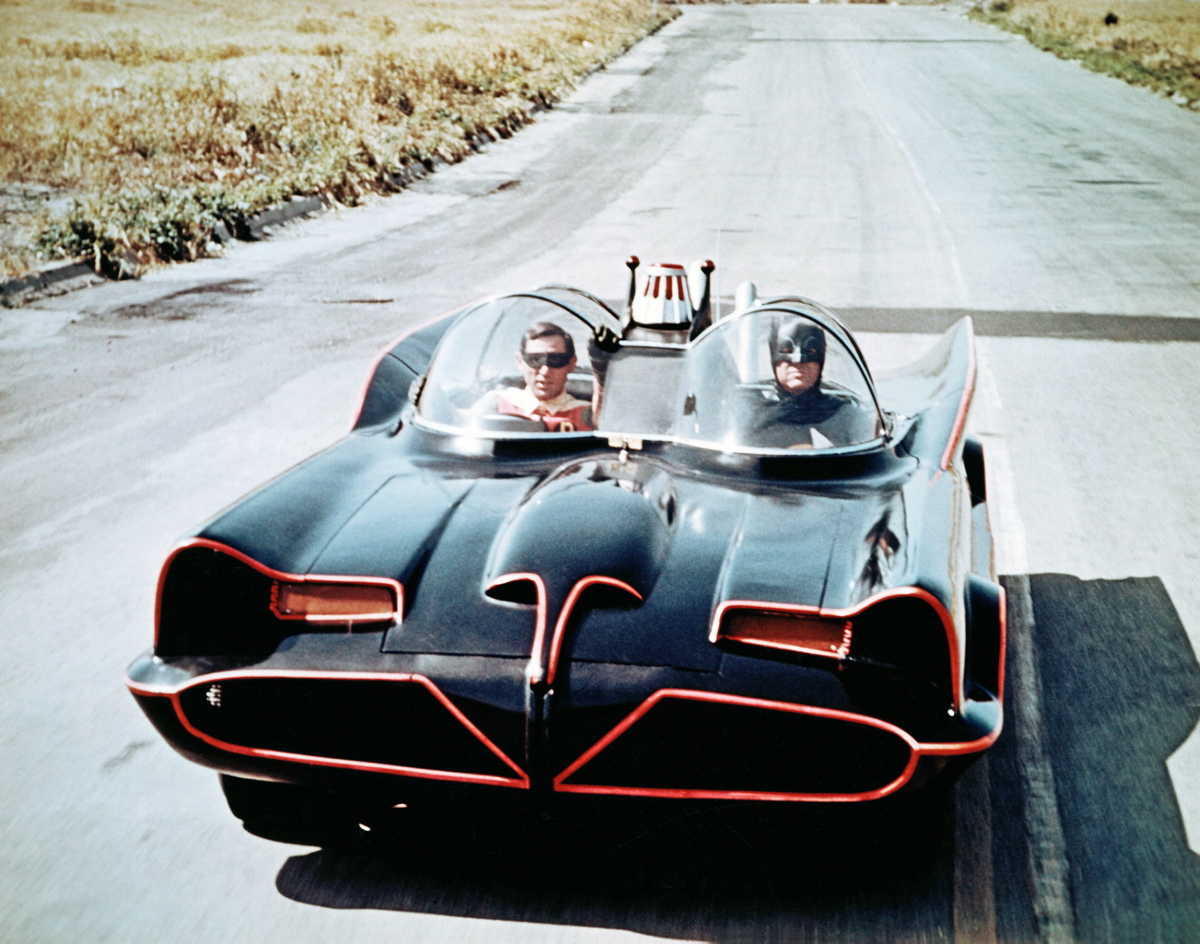 Here, Victor Paul (stunt double for Burt Ward) and Hubie Kerns (stunt double for Adam West), are seen cruising in the Batmobile in the 1966 film. The car was a customized 1955 Lincoln Futura concept car created by Ford Motor Company stylists.