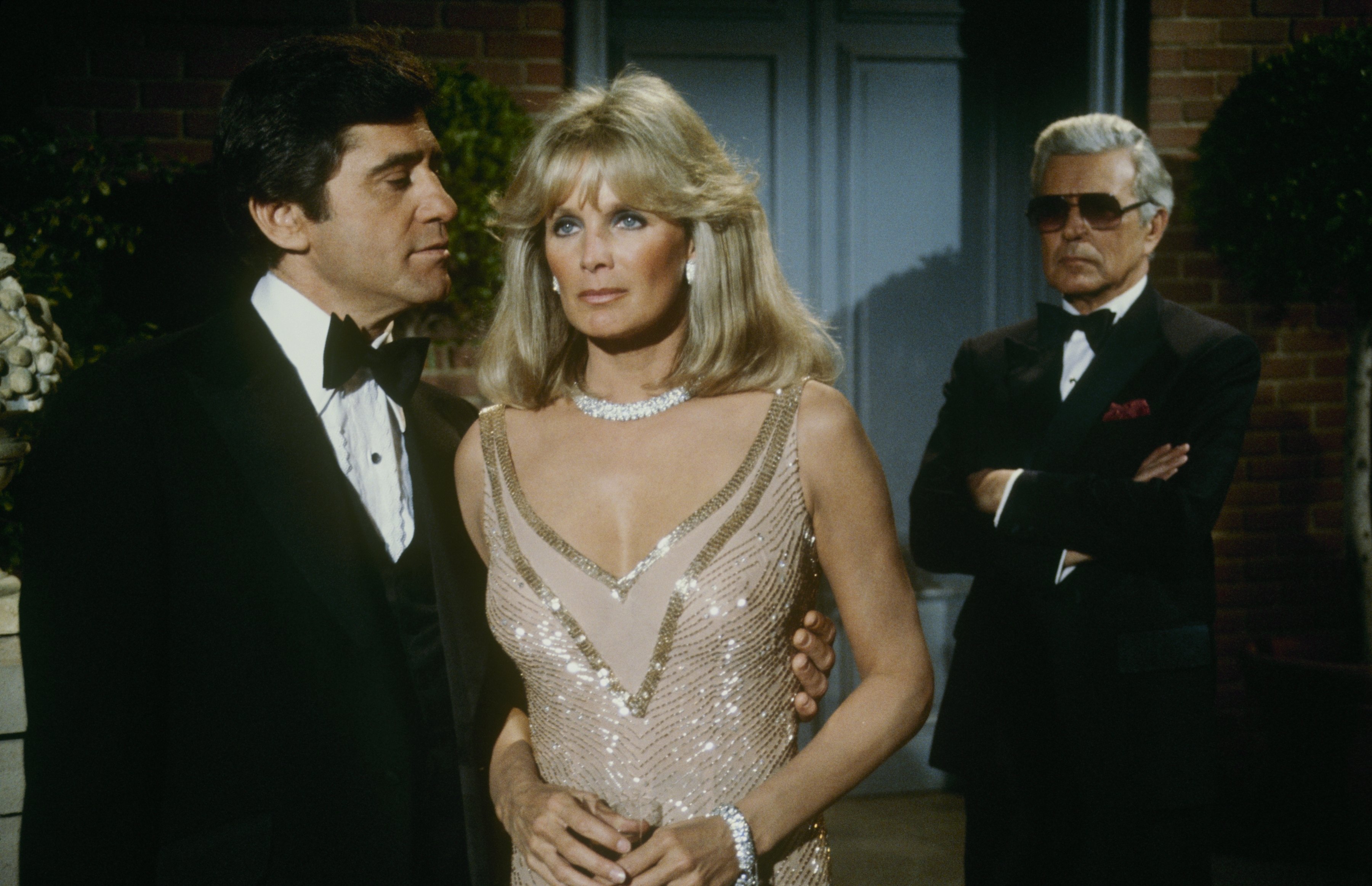 Dr. Nick Toscanni (James Farentino), Krystle (Linda Evans), and Blake (John Forsythe) in the tv show 