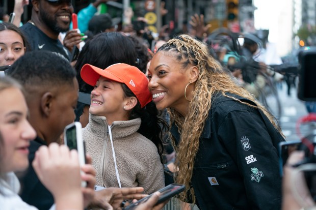 New York Liberty players greet fans after leaving their floats during a ticker-tape parade in Manhattan's 'Canyon of Heroes' on Thursday, Oct. 22, 2024, in Manhattan, New York. (Barry Williams for New York Daily News)