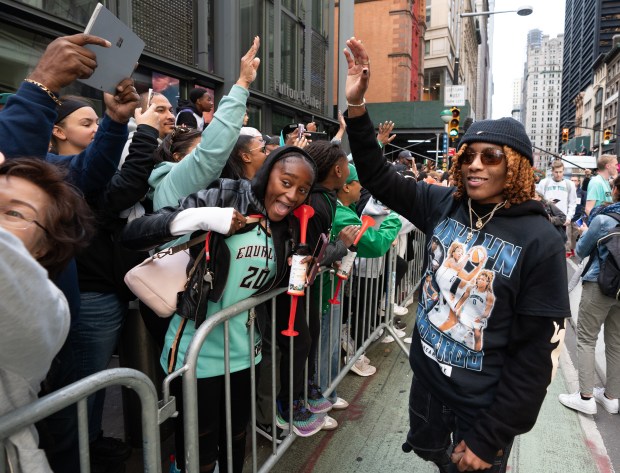 New York Liberty players greet fans after leaving their floats during a ticker-tape parade in Manhattan's 'Canyon of Heroes' on Thursday, Oct. 22, 2024, in Manhattan, New York. (Barry Williams for New York Daily News)