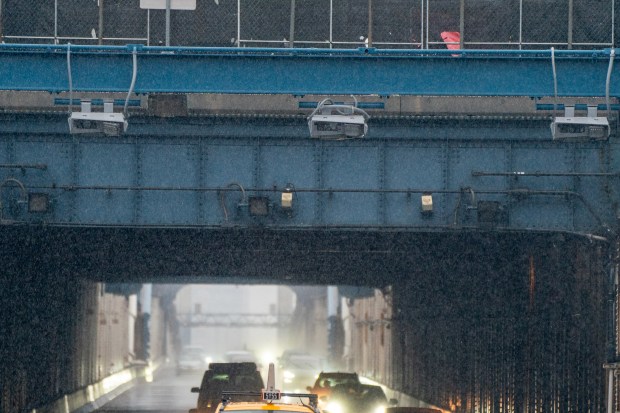 Congestion pricing toll readers are installed over the Manhattan-bound lanes of the Manhattan Bridge.