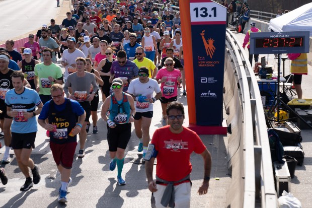 Views of the New York City TCS Marathon as participants make their way across the Pulaski Bridge in Brooklyn on Sunday November 5, 2023. 1129. (Theodore Parisienne for New York Daily News)