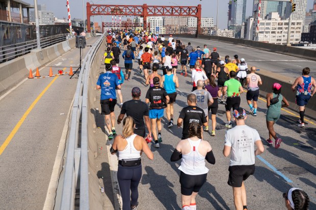 Views of the New York City TCS Marathon as participants make their way across the Pulaski Bridge in Brooklyn on Sunday November 5, 2023. 1129. (Theodore Parisienne for New York Daily News)