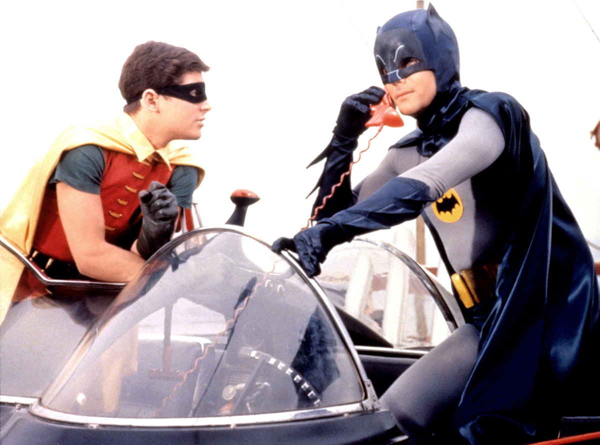 Actors Burt Ward and Adam West are seen here using a Batphone inside of the Batmobile in the 1966 film. The film also featured the Batboat and the Batcopter, both used later in the second and third seasons of the television show.